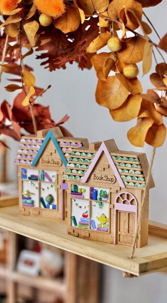 Book Shop - libreria in mosaico con mela